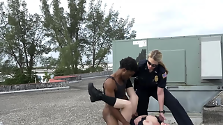 Busty female cops are fucking with black suspect on the roof