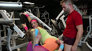 Fitness instructor and two babes are having 3some in the gym